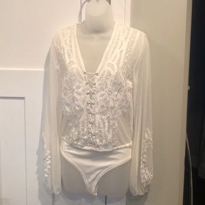 Embroidered mesh lace up bodysuit.